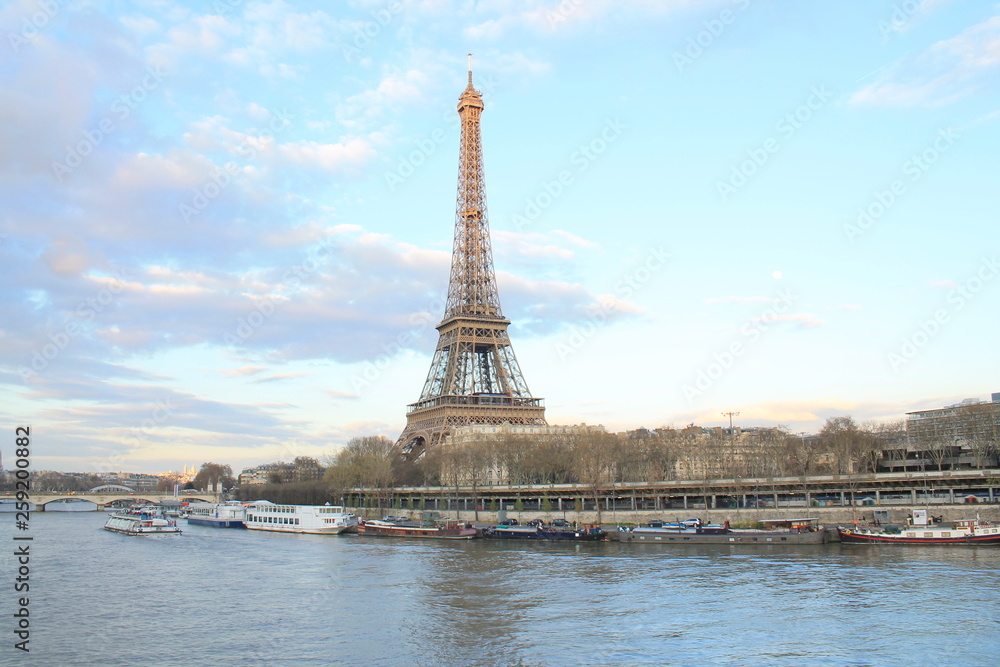 Fototapeta premium Beautiful sky over the Eiffel tower and river seine, Paris capital and the most populous city of France
