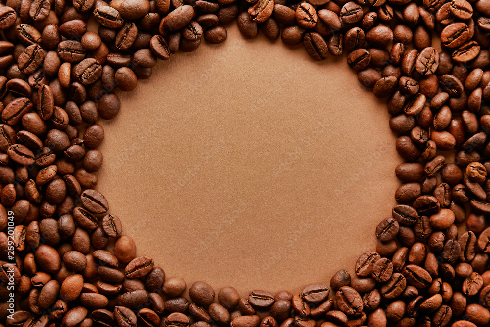Scattered coffee beans frame design on copy space background. Scattered coffee beans frame design on copy space background.