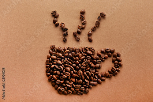 Scattered coffee beans frame design on copy space background.