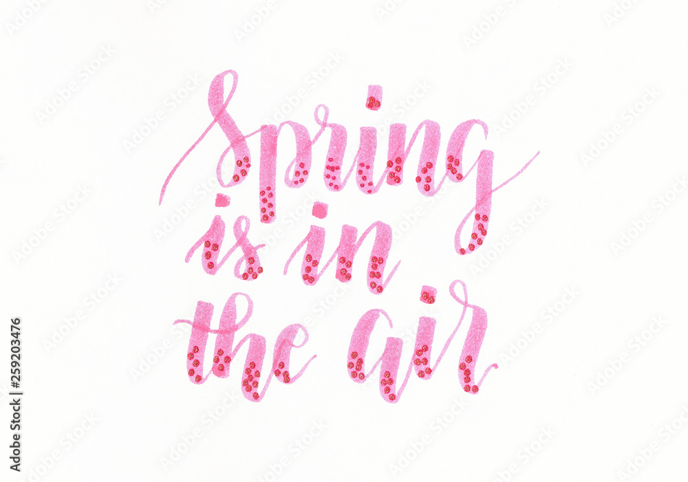Spring is in the air - hand lettering inscription in pink with dots