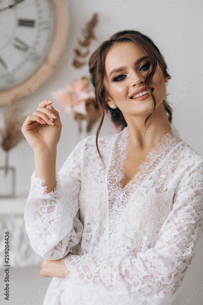 Very beautiful young bride is smiling at the camera Very beautiful young bride is smiling at the camera