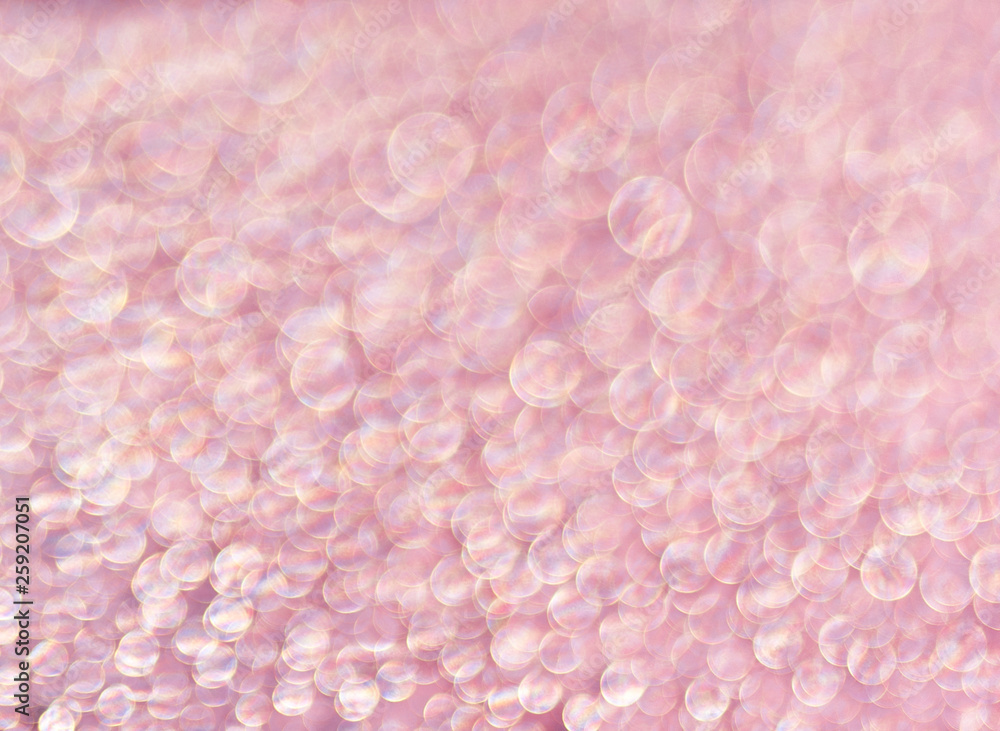 Pink background of shining drops of water