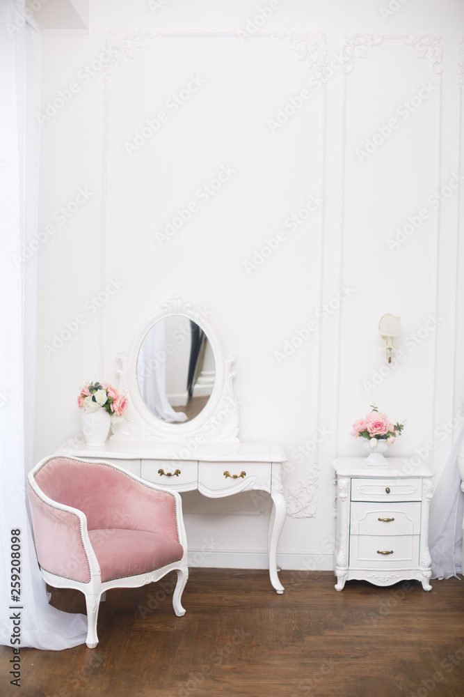 Royal bedroom. Boudoir room with pink soft armchair. Elegant white dressing  table in light classic luxury interior Stock Photo | Adobe Stock