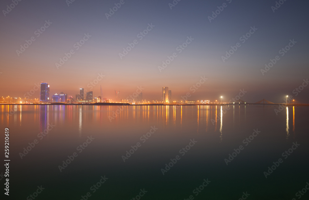 A beautiful view of Bahrain skyline during evening hours at sunset A beautiful view of Bahrain skyline during evening hours at sunset