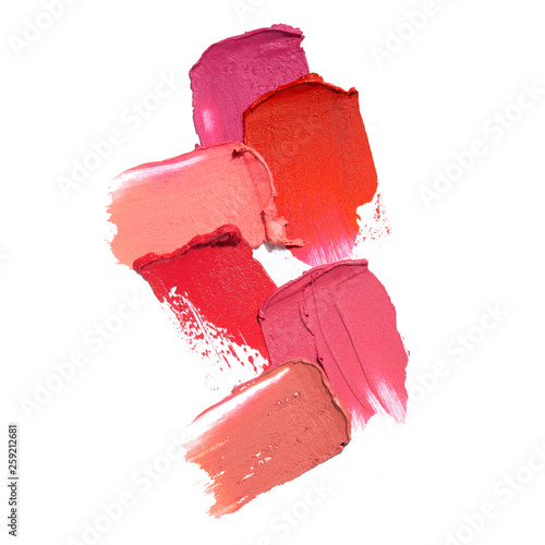 Creative concept photo of cosmetics swatches beauty products lipstick on white background.