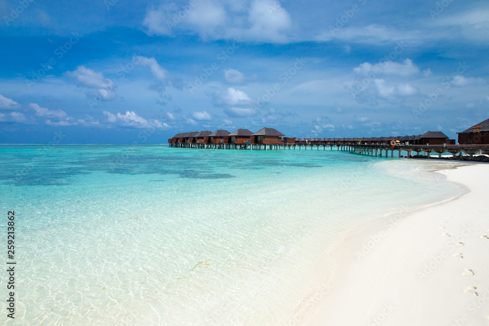 Fototapeta premium tropical Maldives island with white sandy beach and sea