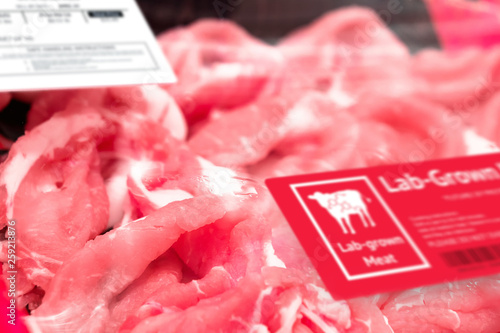 Artificial beef lab grown meat in retail supermarket emerging field of food production with label. Future trend of biotechnology ,  artificial food 4.0 concept. photo