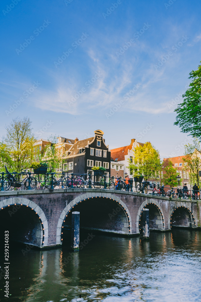 Naklejka premium Amsterdam bridge on sunny day with blue skies in summer