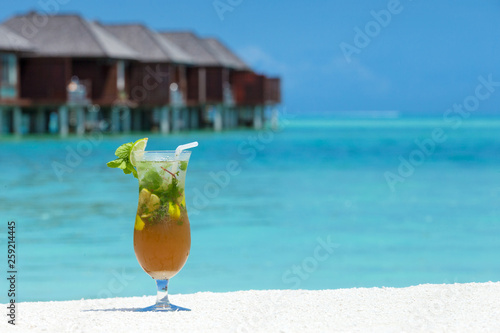 Fototapeta Naklejka Na Ścianę i Meble -  cocktail with blur beach on background