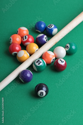 Billiard balls on a green table close-up
