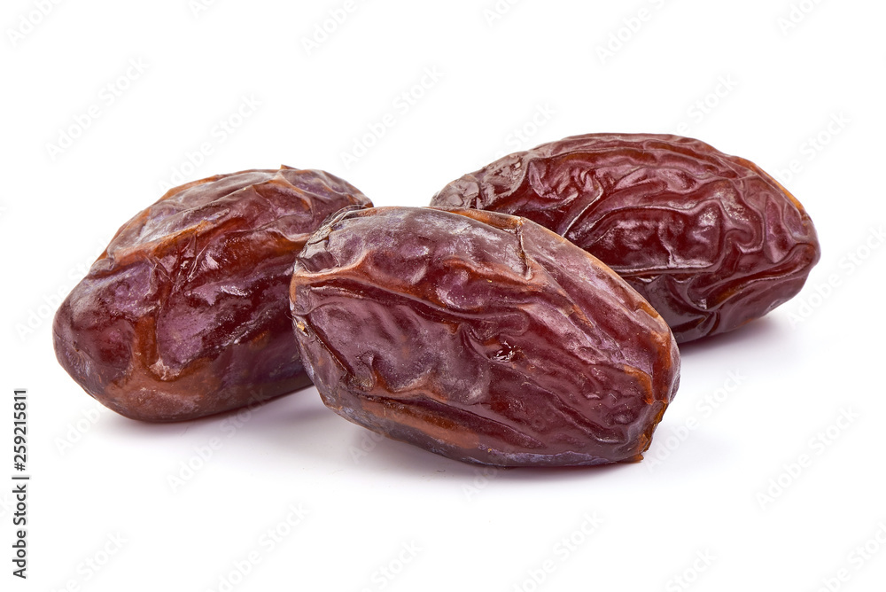 Fresh Medjool dry Dates, close-up, isolated on white background Fresh Medjool dry Dates, close-up, isolated on white background