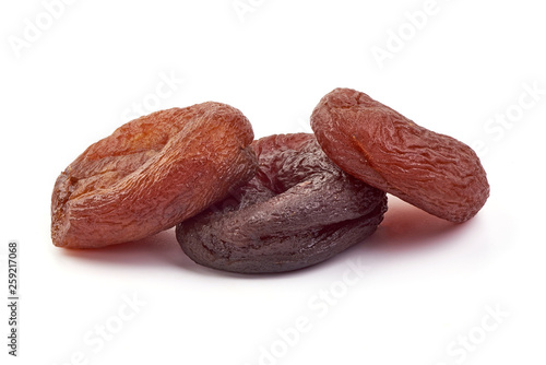 Naturally dried apricots, close-up, isolated on white background