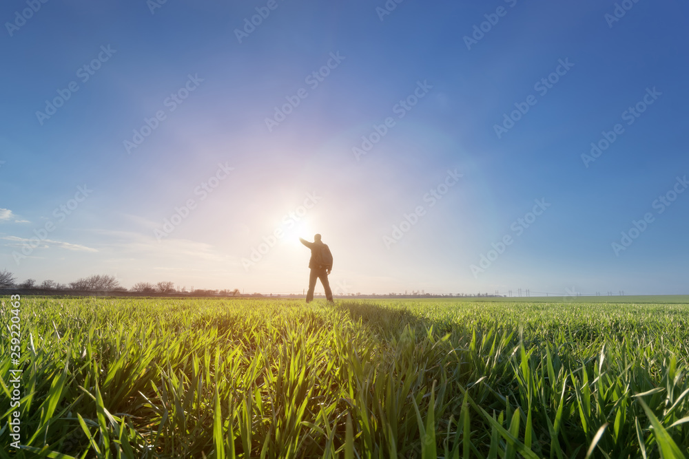 man in field at sunset / bright spring photo Ukraine man in field at sunset / bright spring photo Ukraine