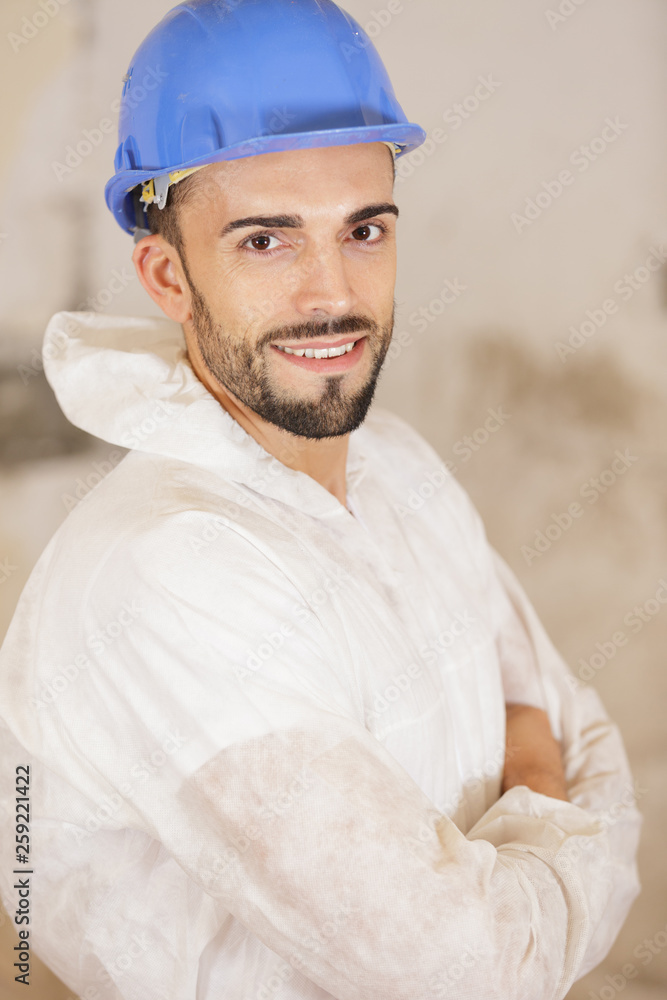 portrait of a builder in protective helmet and suit portrait of a builder in protective helmet and suit
