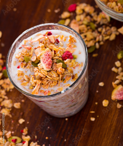 Oatmeal with dried fruit and milk photo