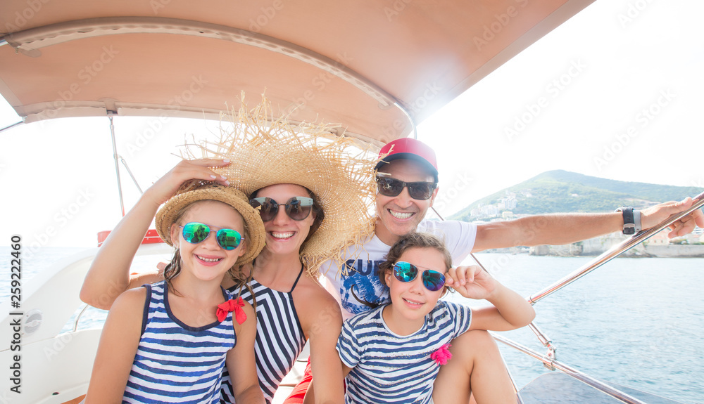 family on sea yacht