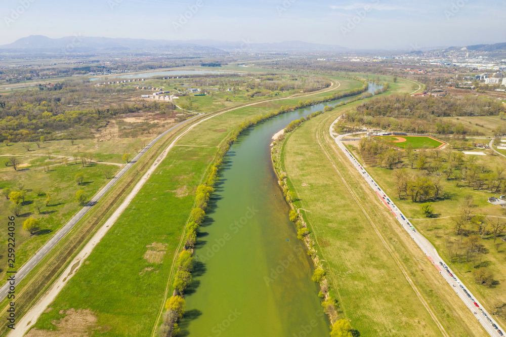 Zagreb, Croatia, beautiful green recreation park area, around Sava river and lake Bundek, panoramic view from drone, city in background