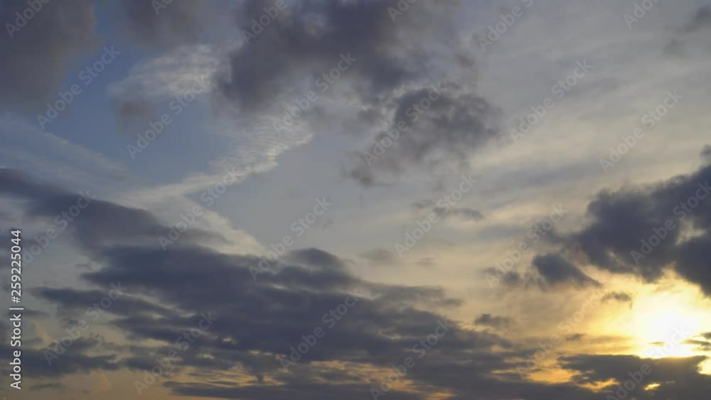 Commercial passenger plane flies toward sunset. Orange and purple clouds, blue sky in the background. Good weather. UltraHD stock footage Commercial passenger plane flies toward sunset. Orange and purple clouds, blue sky in the background. Good weather. UltraHD stock footage