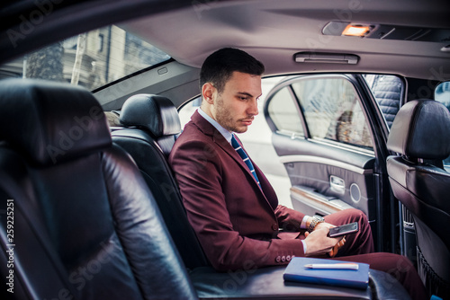 Confident businessman in his luxury sedan car © qunica.com