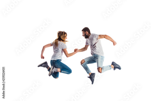 Couple jumping during training dances © qunica.com