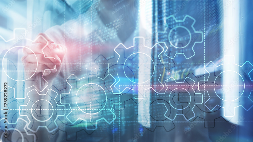 Double exposure gears mechanism on blurred background. Business and industrial process automation concept. Double exposure gears mechanism on blurred background. Business and industrial process automation concept.