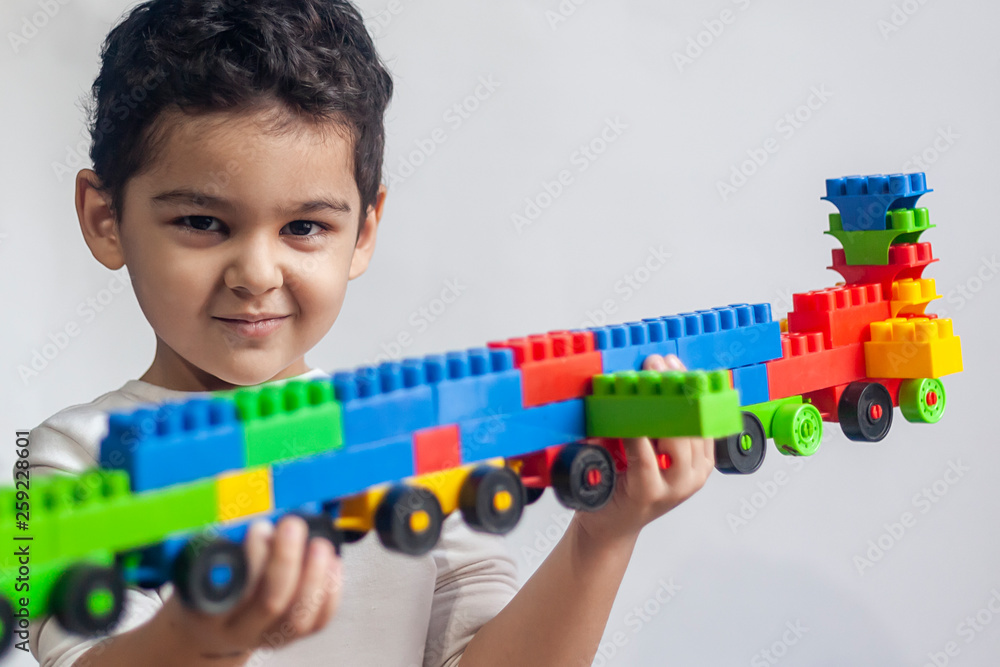 5 years adorable little kid boy playing with plastic brick toys 5 years adorable little kid boy playing with plastic brick toys