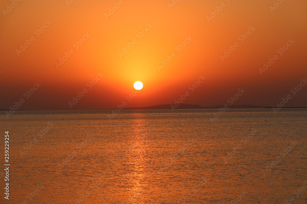 Sunset above sea. Beautiful summer decline above ocean Sunset above sea. Beautiful summer decline above ocean