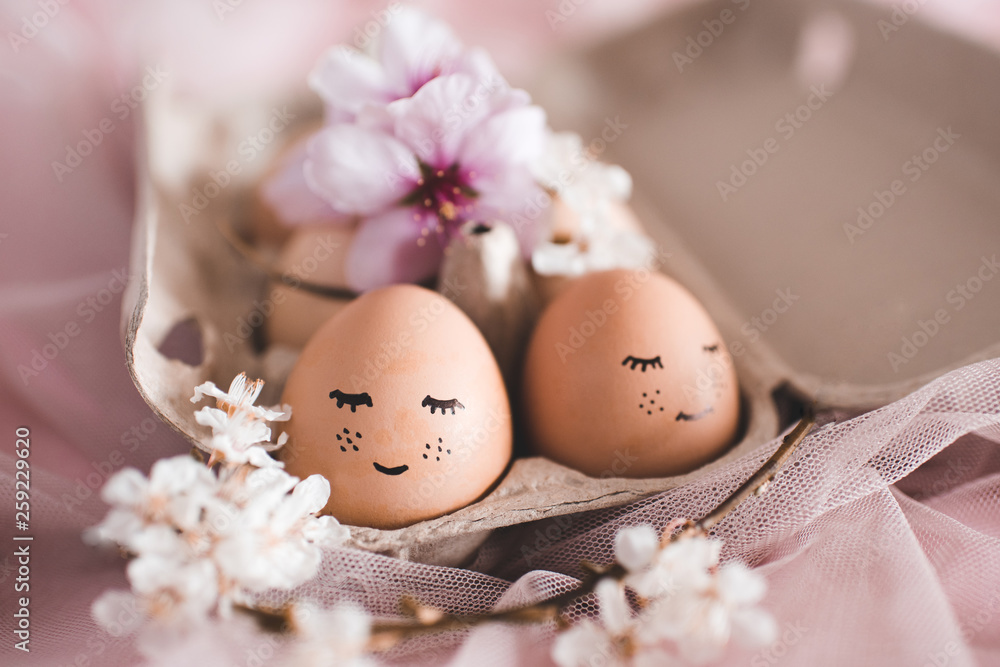 Pretty Easter eggs with flowers in carton box closeup. Celebration. Pretty Easter eggs with flowers in carton box closeup. Celebration.