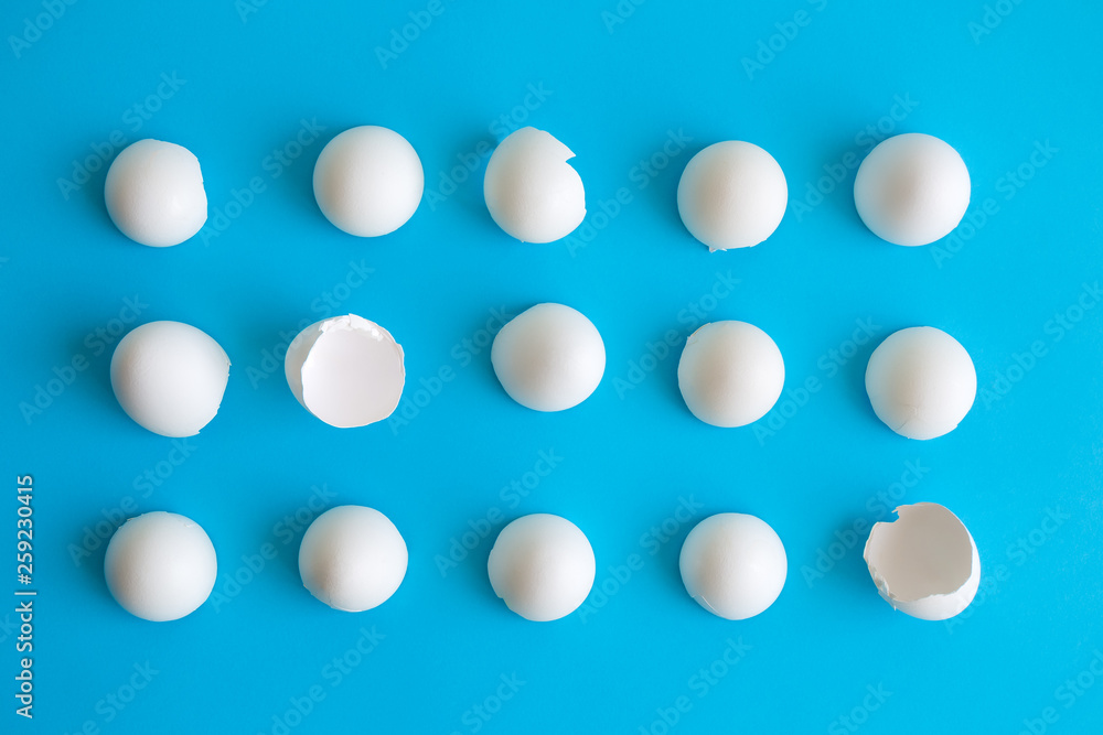 Close up of white eggshells abstract isolated on blue. Close up of white eggshells abstract isolated on blue.