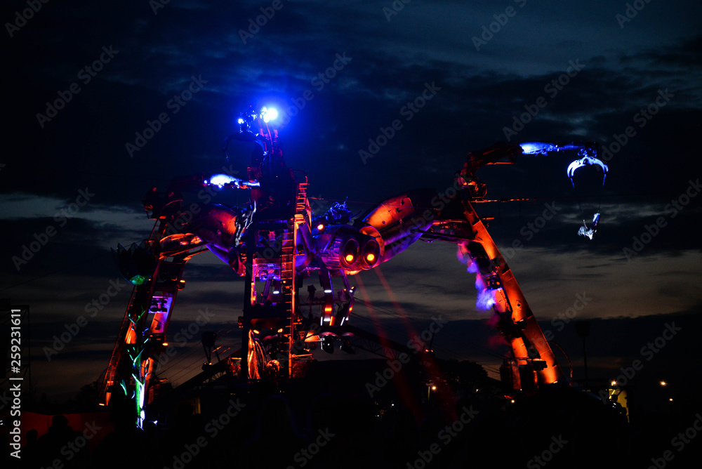 Obraz premium JUNE 23, 2015 : A view of the Arcadia show above the crowd at the first night of the Glastonbury Festival 2015
