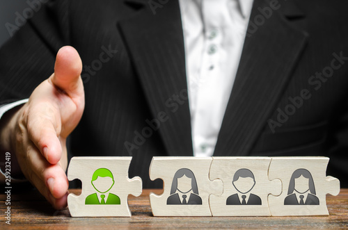 A businessman joins a new employee to the team as its leader. Hiring new employees for the project., teamwork. leader works with the team as a member. increasing efficiency, confidence, communication photo