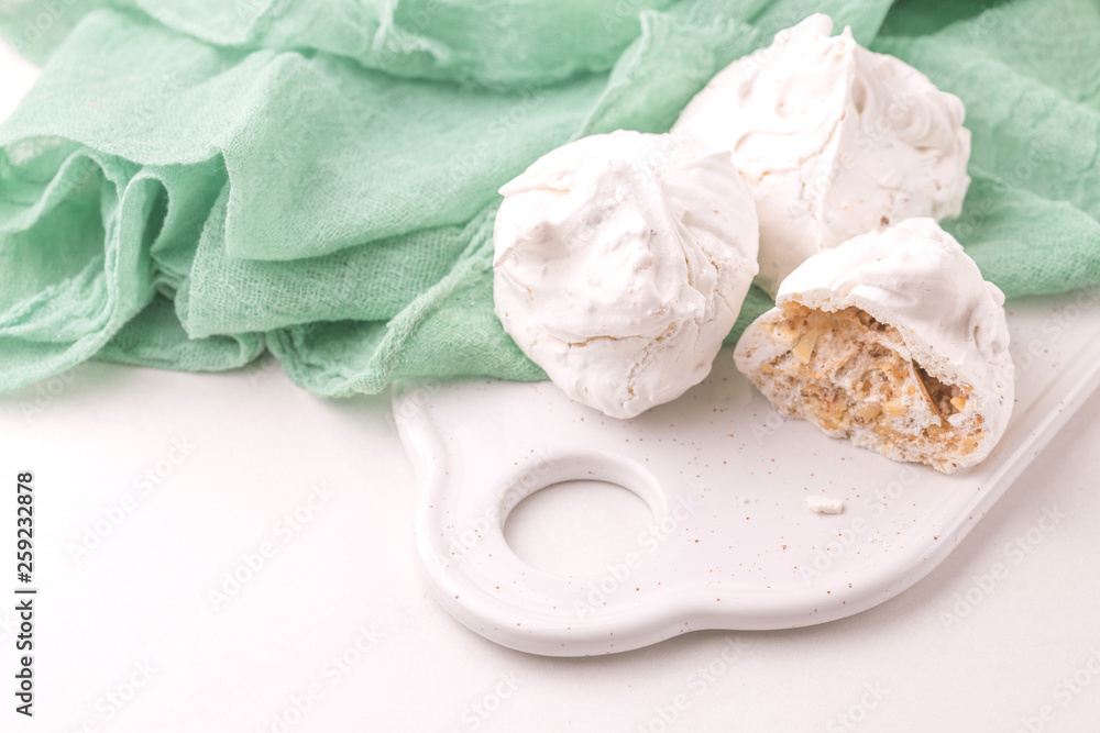 dessert. French meringues with nuts, pistachios dessert. French meringues with nuts, pistachios