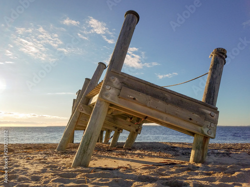 Fotografie Storm-damaged Piers on the Beach