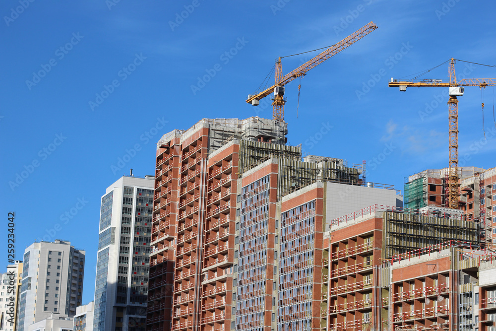 Lots of tower Construction site with cranes and building with blue sky background