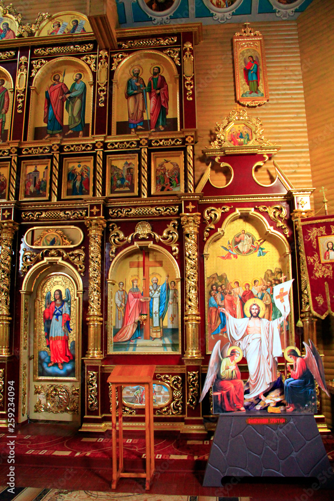 Beautiful iconostasis with ancient icons set in golden frames