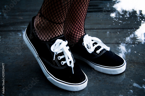 pair of sneakers on dark background