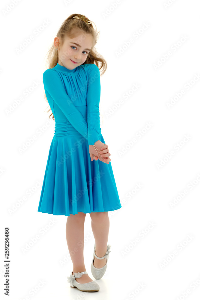 A cheerful little girl is dancing. A cheerful little girl is dancing.
