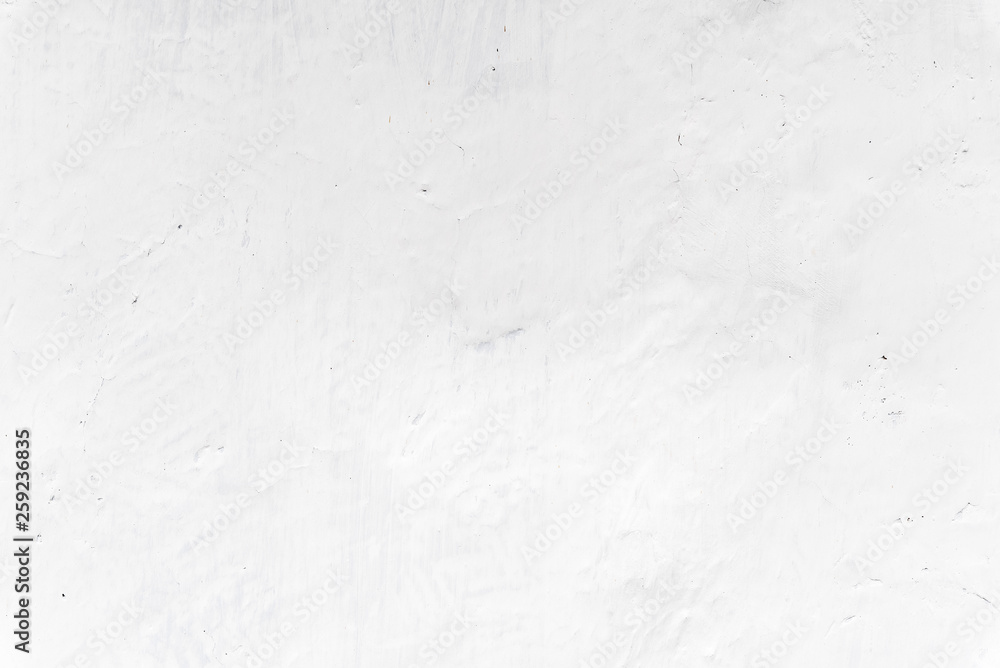 Obraz premium Adobe whitewashed wall in natural white color, traces of brush, texture and background