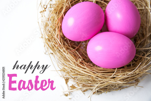  Easter colored pink eggs in egg nest, soft focus image. Happy Easter Card