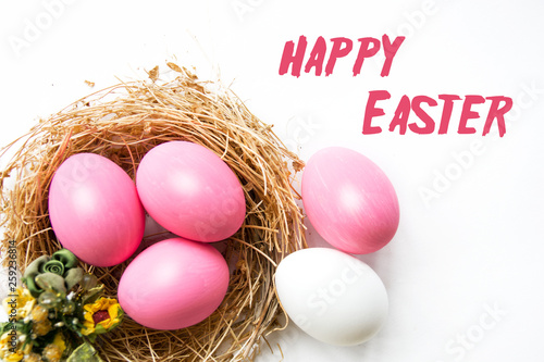  Easter colored pink eggs in egg nest, soft focus image. Happy Easter Card