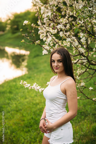 Lady in white near the lake