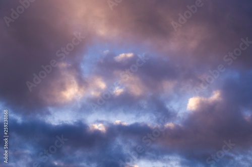 blue evening sky with white and gray clouds; cumulus. background; nature