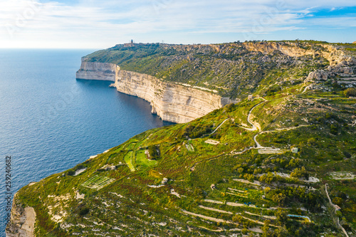 Aerial view of Dingli cliffs. Greeny nature and blue sea and sky. Malta island.  photo