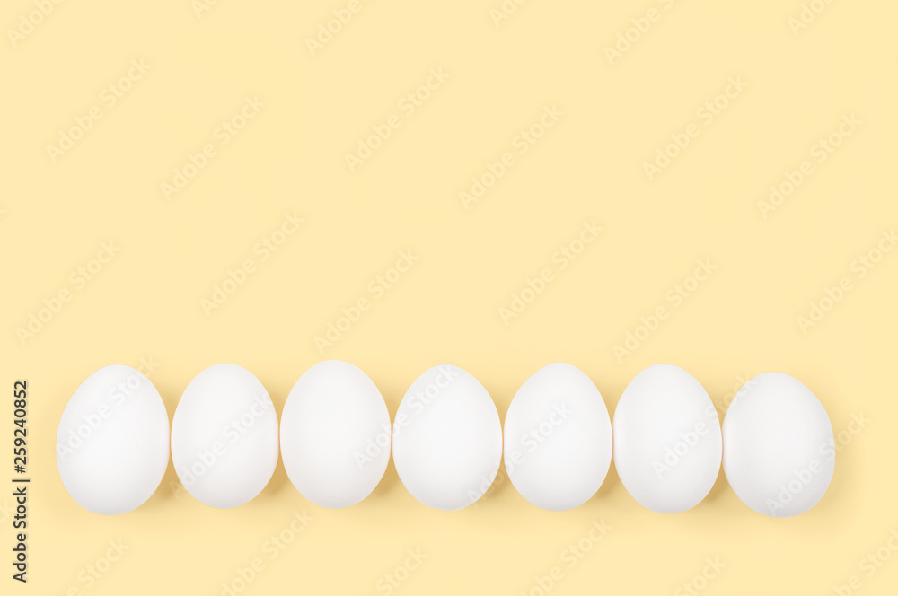 White egg. Raw eggs on pastel yellow background. White egg. Raw eggs on pastel yellow background.