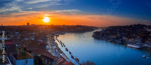 Porto Cityscape with Dom Luis I Bridge over Douro River and medieval Ribeira district at sunset, Portugal