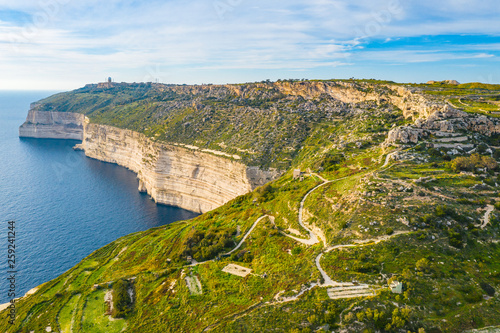 Aerial view of Dingli cliffs. Greeny nature and blue sea and sky. Malta island. 