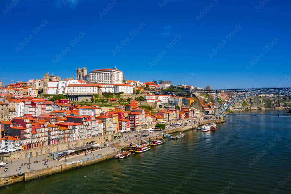 Porto Cityscape with Dom Luis I Bridge over Douro River and medieval Ribeira district at day time, Portugal