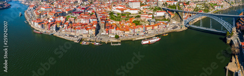 Porto Cityscape with Dom Luis I Bridge over Douro River and medieval Ribeira district at day time, Portugal