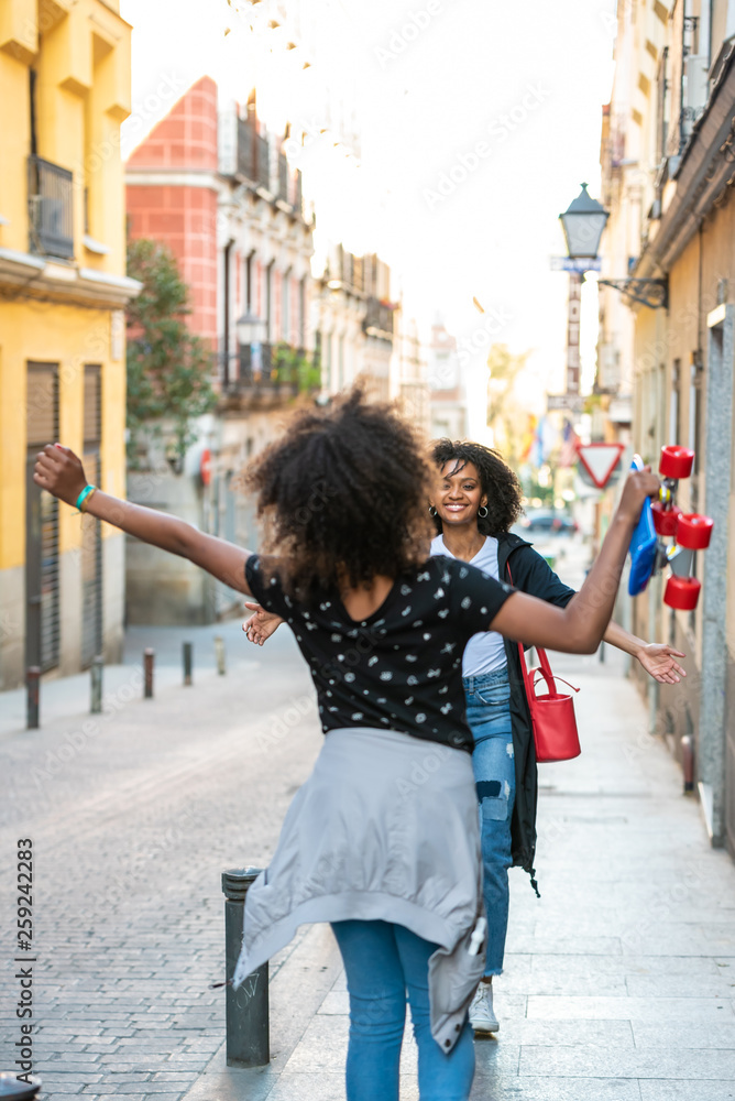 Young Afro American Mother Getting her Daughter from School.