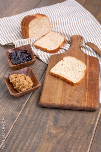 Peanut Butter, Grape Jelly, Loaf Bread Gathered to Make Sandwiches © DiAnna